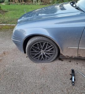 Janet's car with a flat tyre
